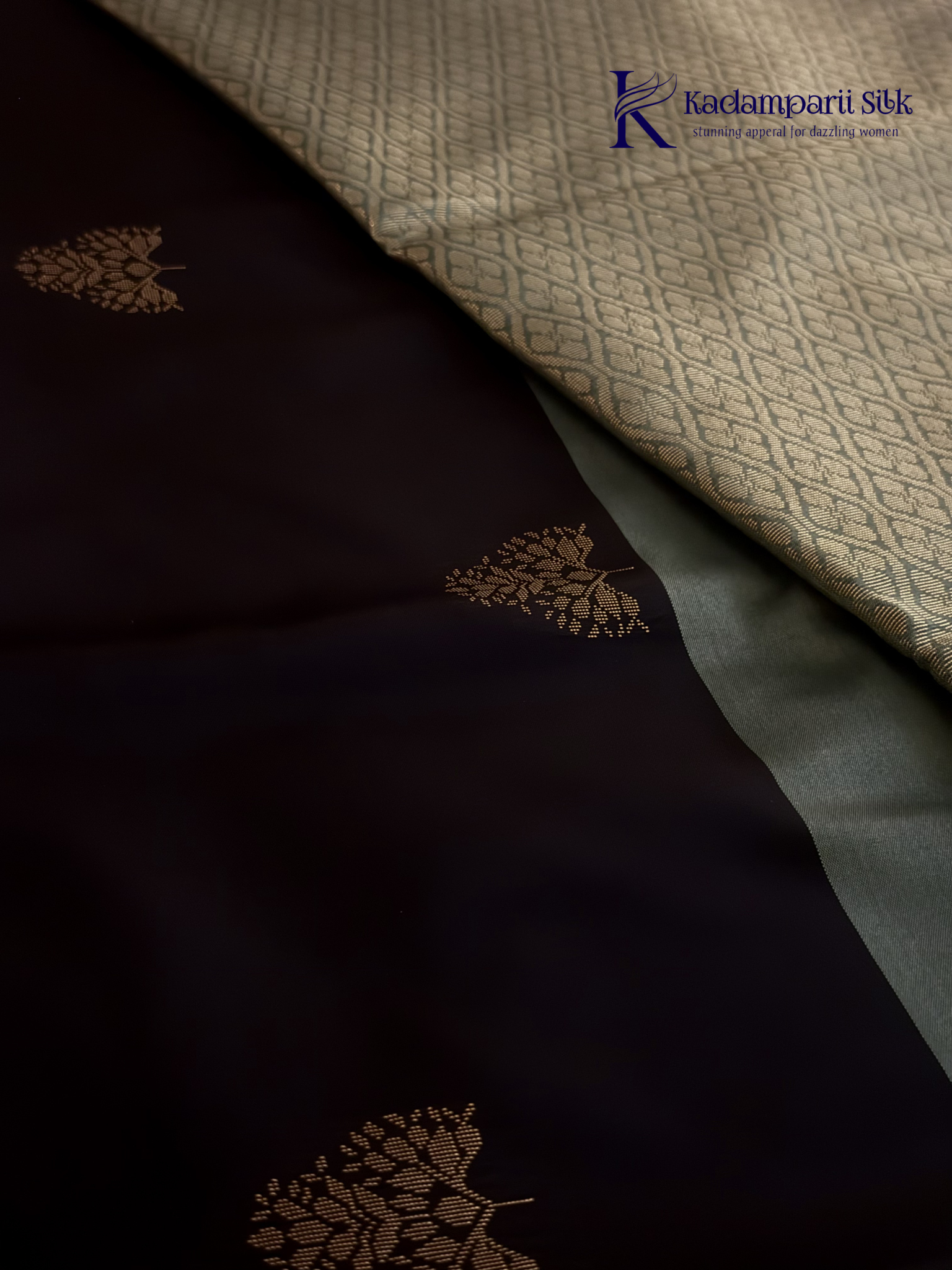 Kadamparii Silk black and sage green semi soft silk saree with gold zari buttas, intricate woven border, rich zari pallu, and tassel detailing.
