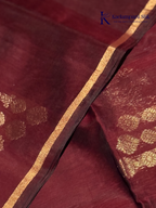 Close-up of maroon fabric with gold patterns Kadamparii Silk