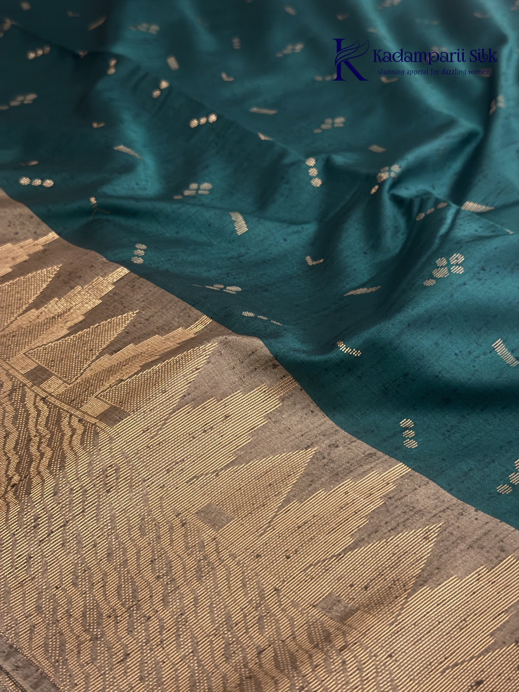 Kadamparii Silk teal green jute mixed semi soft silk saree with golden zari border, woven pallu, subtle motifs, and tassel detailing.