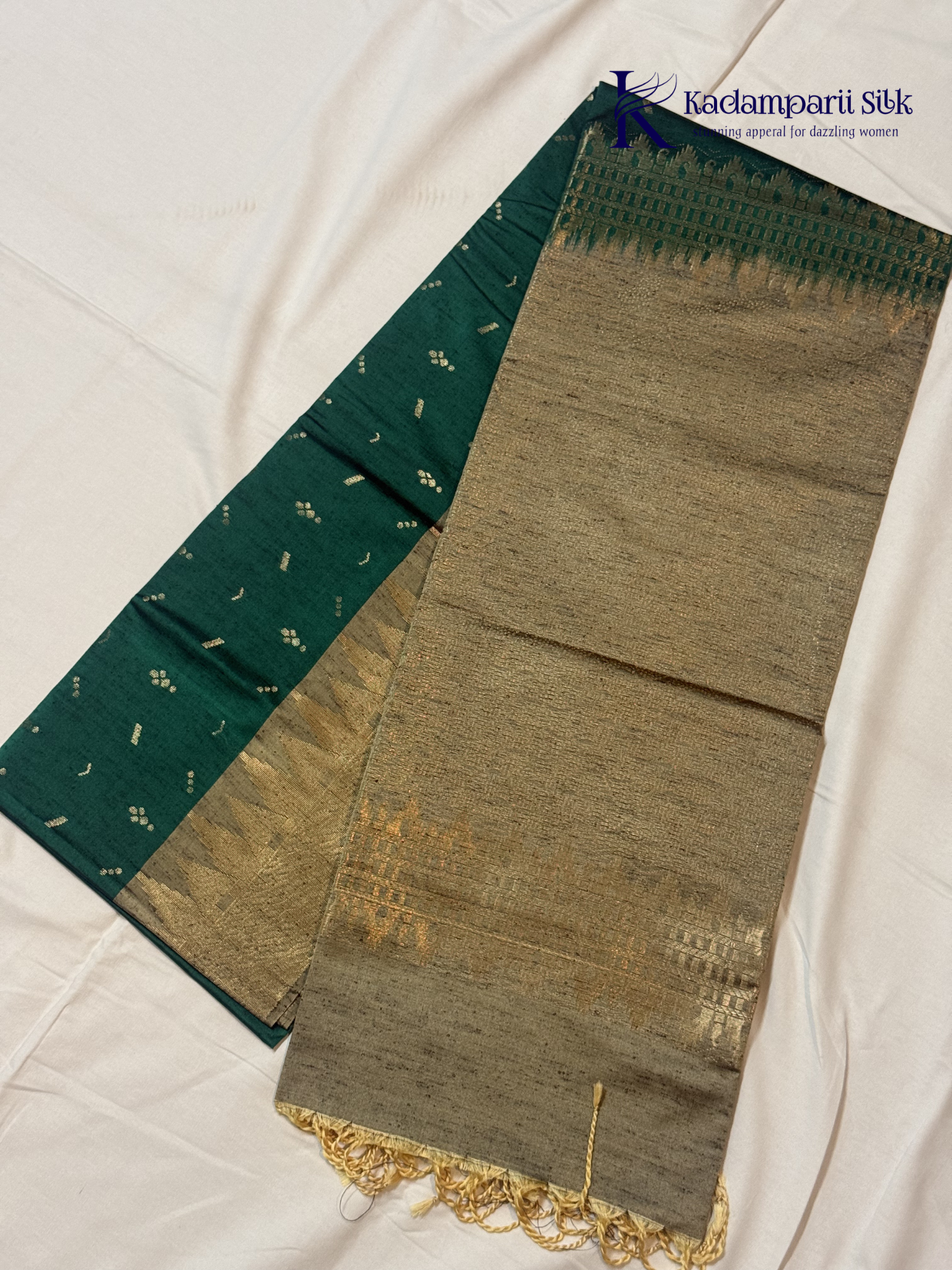Kadamparii Silk teal green jute mixed semi soft silk saree with golden zari border, woven pallu, subtle motifs, and tassel detailing.