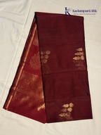 Maroon saree with gold patterns on a white background, featuring the Kadambarii Silk