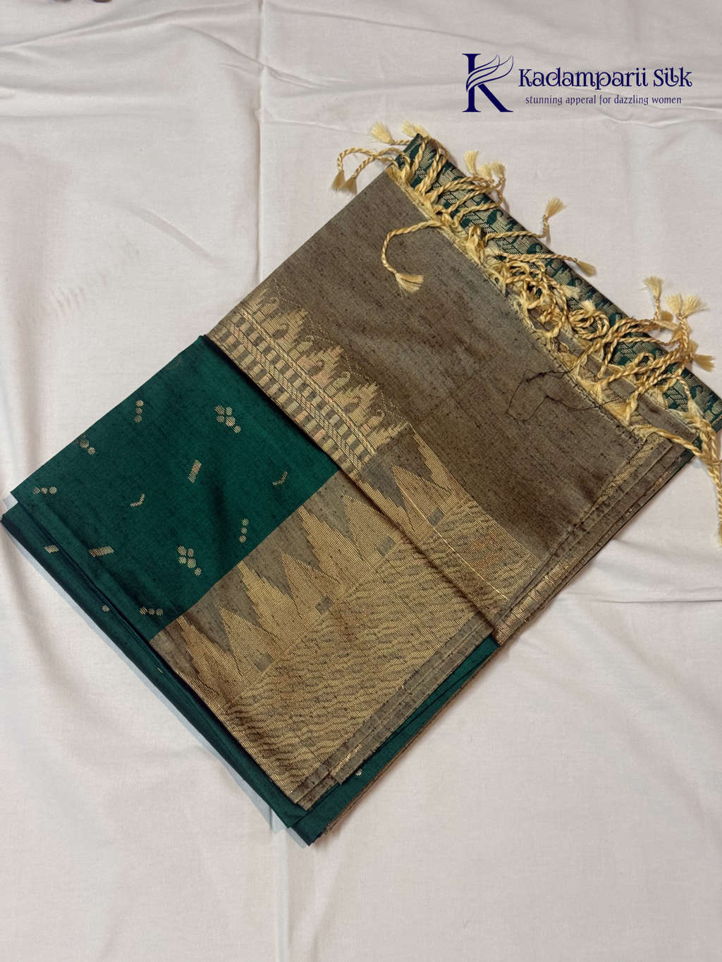 Kadamparii Silk teal green jute mixed semi soft silk saree with golden zari border, woven pallu, subtle motifs, and tassel detailing.