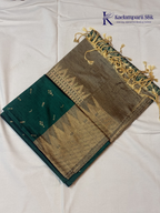 Kadamparii Silk teal green jute mixed semi soft silk saree with golden zari border, woven pallu, subtle motifs, and tassel detailing.