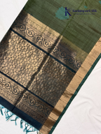 Green and gold embroidered fabric with Kadiamparii Silk branding.