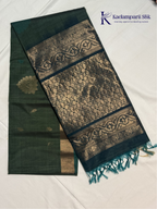Green and black saree with intricate patterns on a white background, featuring the brand 'Kadamparii Silk'.Silk Cotton