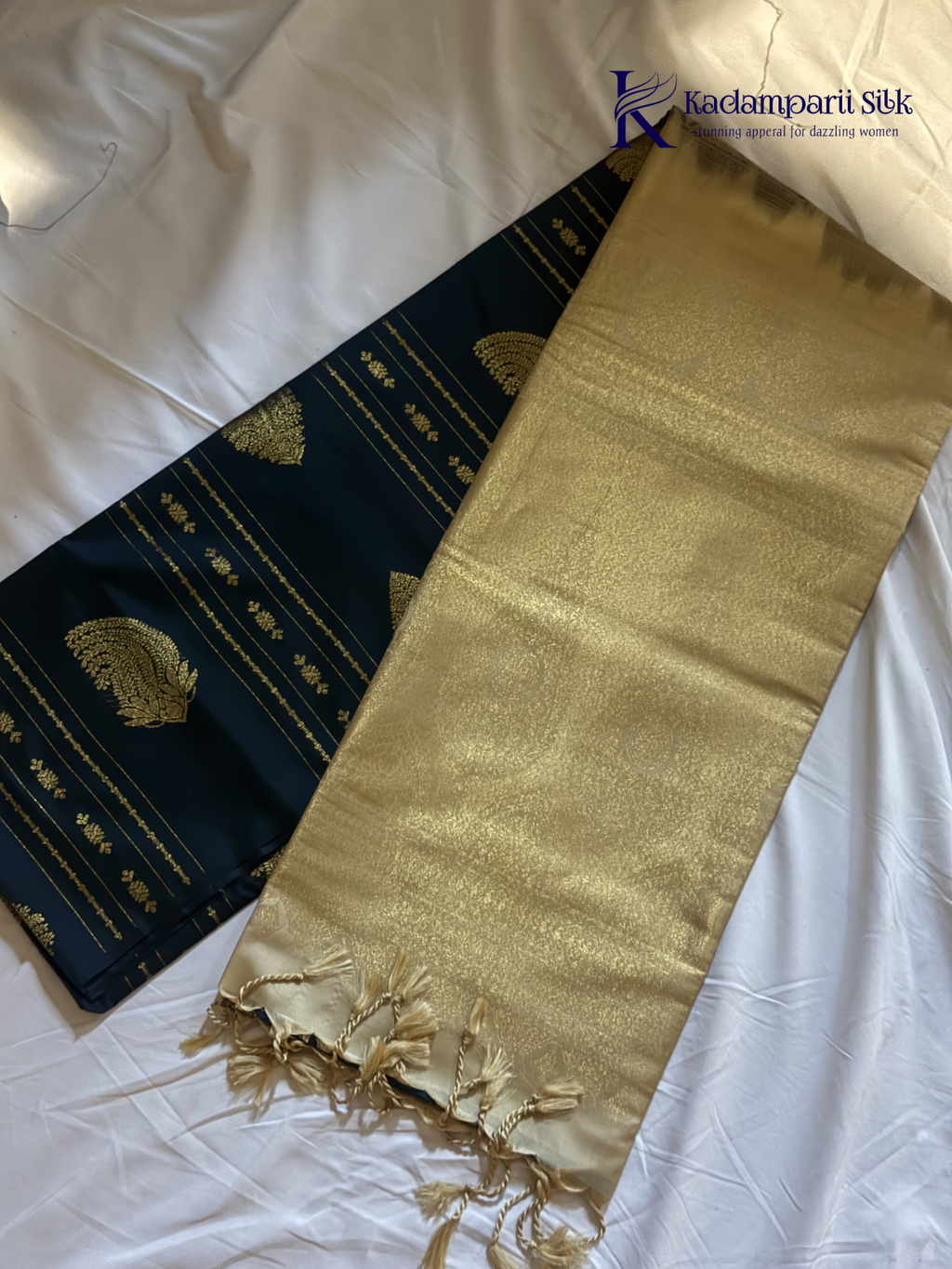 Kadamparii Silk royal navy blue semi soft silk saree with gold zari motifs, paisley design, grand zari woven pallu, and tassel detailing.