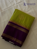 Lime green art silk saree with purple zari border and traditional woven detailing displayed on white background Kadamparii Silk
