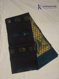 Black saree with gold and blue patterns on a white background, branded 'Kadamparii Silk'. Silk Cotton