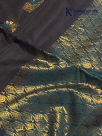 Black saree with gold and blue patterns on a white background, branded 'Kadamparii Silk'. Silk Cotton