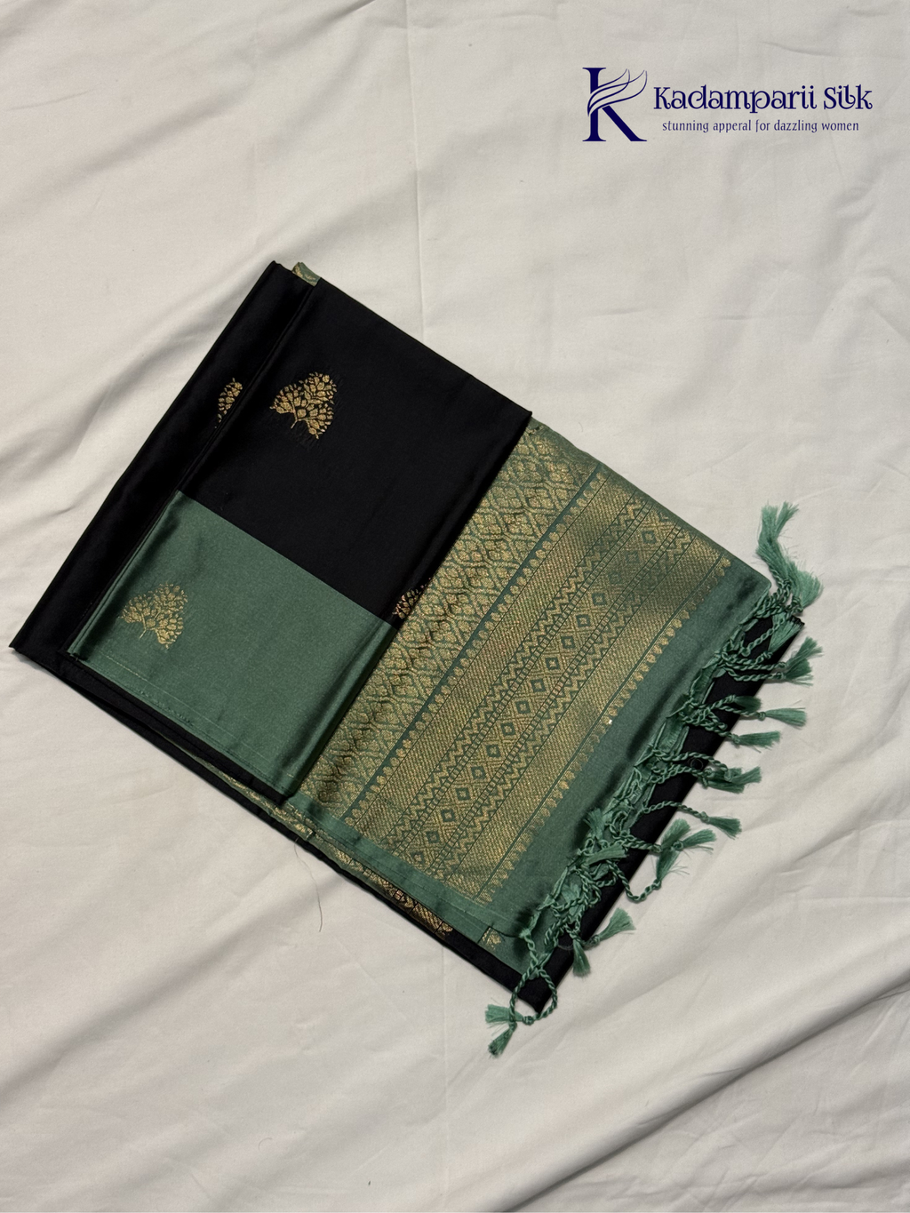 Kadamparii Silk black and sage green semi soft silk saree with gold zari buttas, intricate woven border, rich zari pallu, and tassel detailing.