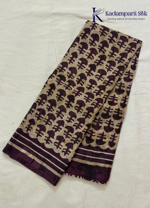 Kadamparii Silk beige semi tussar silk printed saree with wine colour pattern and matching striped border, displayed on a white background.