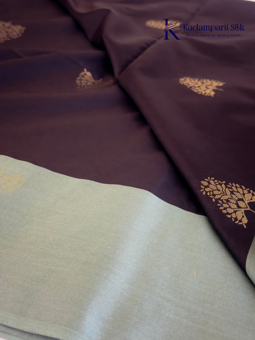 Kadamparii Silk black and sage green semi soft silk saree with gold zari buttas, intricate woven border, rich zari pallu, and tassel detailing.