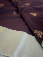 Kadamparii Silk black and sage green semi soft silk saree with gold zari buttas, intricate woven border, rich zari pallu, and tassel detailing.